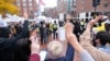 Pro-Thai democracy protesters make a three-finger salute during a clash between pro-Thai democracy protesters and Thai royalists during the demonstration at King Bhumibol Adulyadej Square in Cambridge, MA Nov 1, 2020.