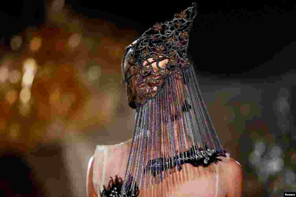 A model presents a creation during the Charles Jeffrey LOVERBOY catwalk show at London Fashion Week Men's in London, Jan. 5, 2019.