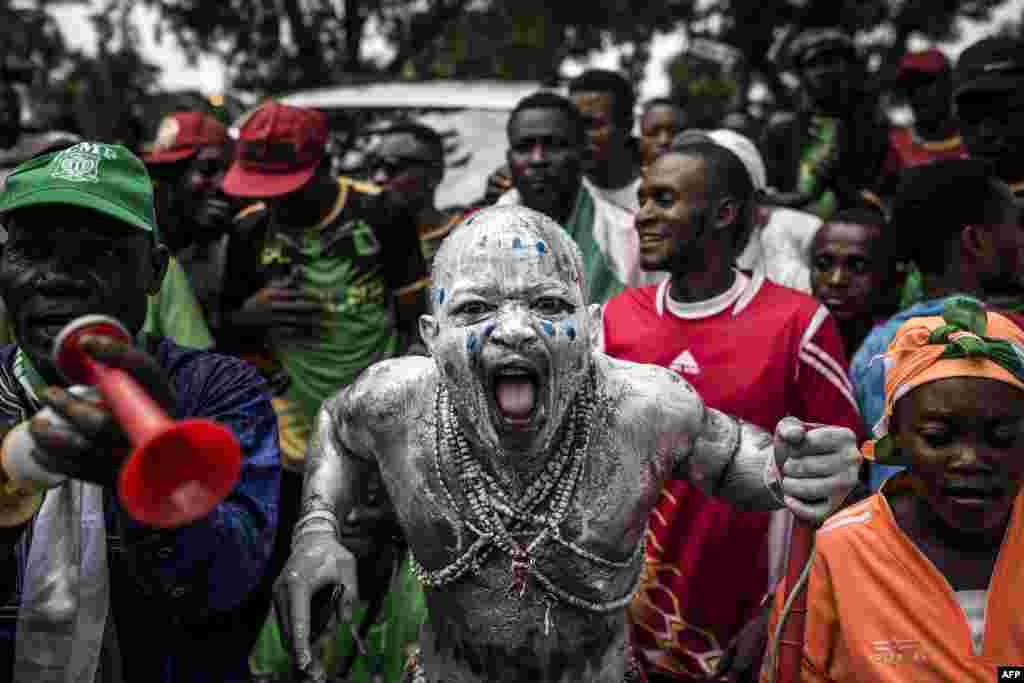 Supporters of newly elected President of the Democratic Republic of Congo Felix Tshisekedi cheer as they arrive to attend his Presidential Inauguration in Kinshasa.