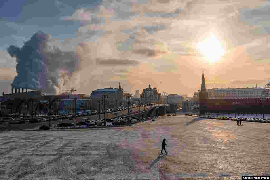 A man walks on Vasilyevsky Spusk (The Basil's Downhill) at the Kremlin during a frosty day, with the air temperature at around minus 21 degrees Celsius, in downtown Moscow.