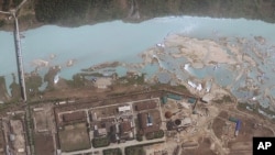 FILE - satellite image provided by GeoEye shows the area around the Yongbyon nuclear facility in Yongbyon, North Korea. The U.S.-Korea Institute at Johns Hopkins School of Advanced International Studies said shows that North Korea has resumed building wor