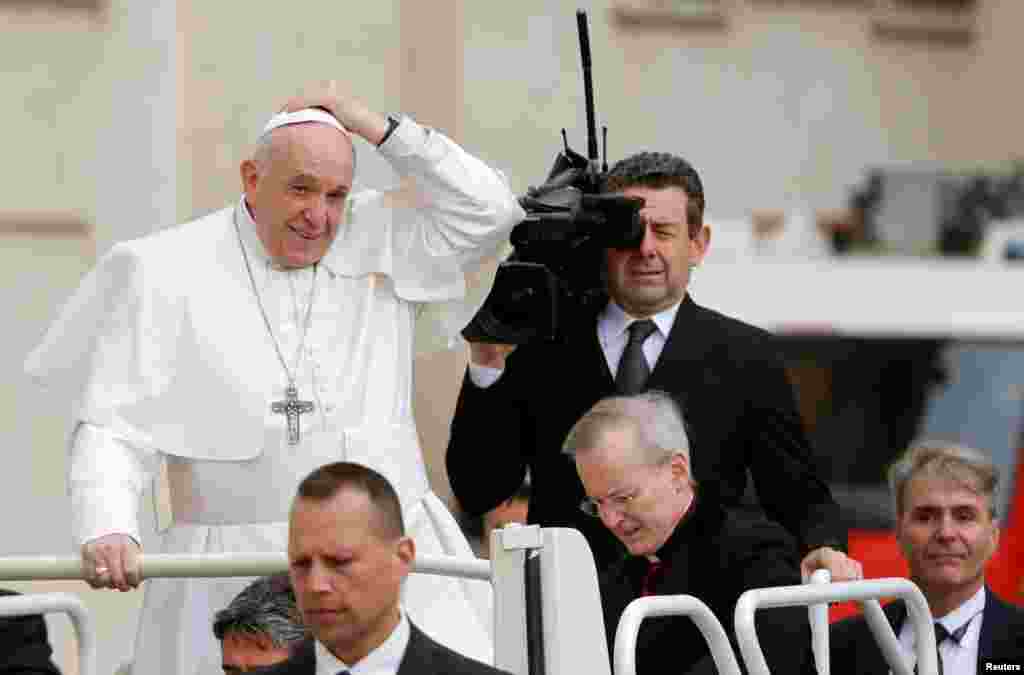Pope Francis arrives to lead the Wednesday general audience in Saint Peter's Square at the Vatican.