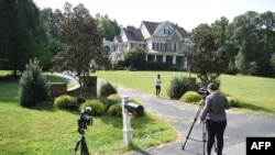 Photographers take photos of the Oleg Smolenkov's house in Stafford, Virginia, Russian media named Smolenkov as the alleged spy the U.S. extracted from Russia in 2017.