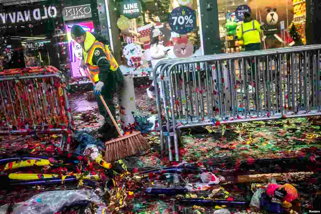Workers clean up the area after New Year's Eve celebrations in Times Square in New York City.