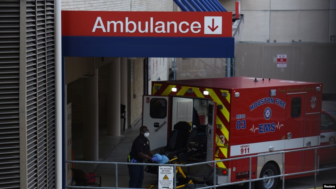 A healthcare worker places a stretcher inside of an ambulance at the emergency room entrance of Houston Methodist Hospital in the Texas Medical Center as cases of the coronavirus disease (COVID-19) spike in Houston, Texas, U.S., July 8, 2020. 