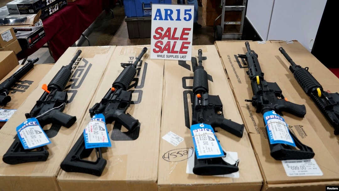 FILE - AR-15 rifles are displayed for sale at a gun show in Pennsylvania, Oct. 6, 2017. 