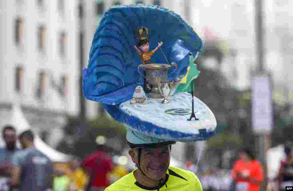 A disguised runner is pictured before the start of the 94th 15-km Sao Silvestre international race in Sao Paulo, Brazil. Thirty thousand runners participated in the traditional New Year's Eve event.
