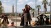 Relatives of freed detainees released unilaterally by Saudi Arabia wait for their arrival at Sanaa Airport on an International Committee of the Red Cross (ICRC) plane after three days of prisoner swaps between two sides in the Yemen conflict, in Sanaa, Yemen, April 17, 2023. 