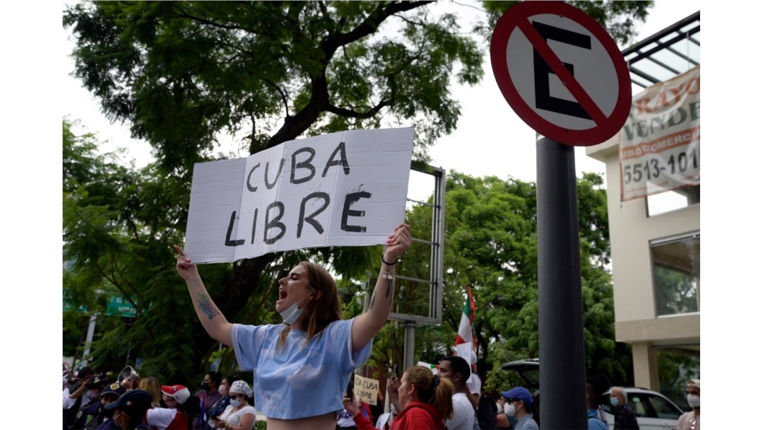 Cuban citizens take part in a demonstration against Cuban President Miguel Diaz-Canel's government outside the Cuban Embassy, in Mexico City on July 12, 2021.