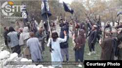 FILE - Fighters with IS-Khorasan, the affiliate in Afghanistan, vow allegiance to their Islamic State leader, in this photo issued Nov. 5, 2019, by SITE Intelligence Group. 