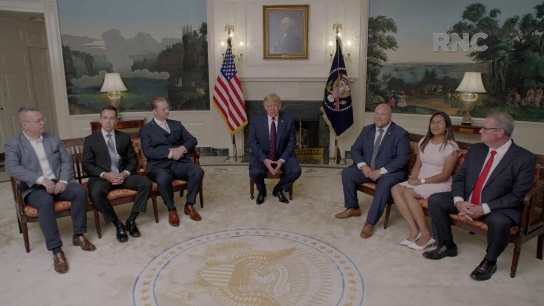 President Donald Trump talks to former U.S. hostages during a segment recorded at the White House, which aired during the first night of the Republican National Convention, Aug. 23, 2020.