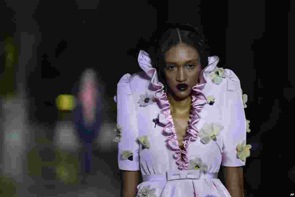 A model wears a creation for the Viktor&Rolf Spring-Summer 2022 Haute Couture fashion collection, in Paris, France.