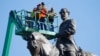 An inspection crew f takes measurements as they inspect the statue of Confederate Gen. Robert E. Lee on Monument Avenue June 8, 2020, in Richmond, Va. Virginia Gov. Ralph Northam has ordered the removal of the statue. 