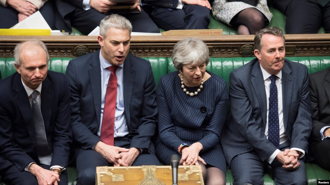 FILE - Britain's Prime Minister Theresa May reacts during the debate on extending Brexit negotiating period in Parliament in London, Britain, March 14, 2019. 
