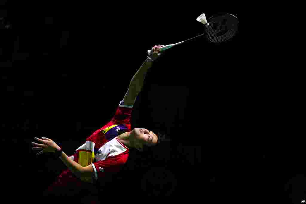 Taiwan's Pai You Po returns a shot to Japan's Sayaka Takahashi during their women's badminton singles match at the BWF World Championships in Huelva, Spain.