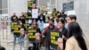 A group of Thai demonstrator holds the portraits of late Vicha Ratanapakdee, during a rally to raise awareness of anti-Asian violence outside the Hall of Justice, SF.