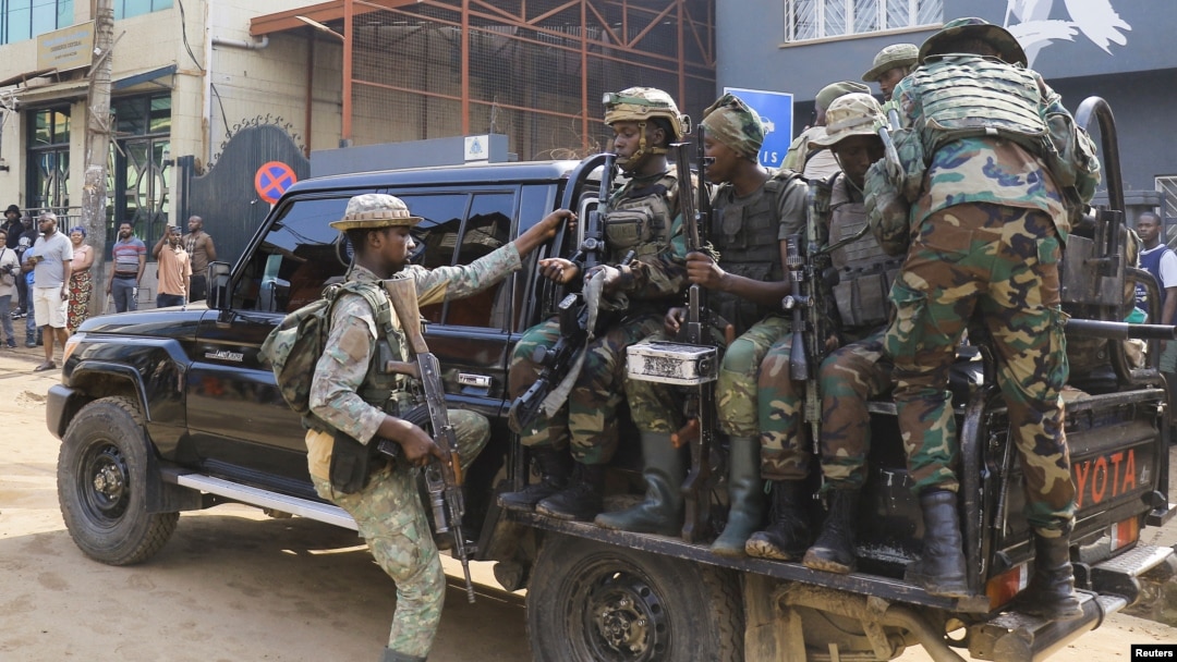 Members of the M23 rebel group gather on their truck after recovering guns during a community exercise aimed at strengthening local solidarity, following their takeover of Bukavu, eastern Democratic Republic of Congo, Feb. 20, 2025. 