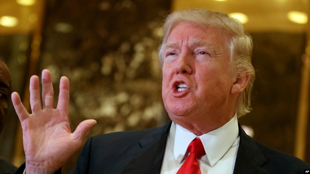 President-elect Donald Trump speaks with reporters in the lobby of Trump Tower in New York. Trump has offered views on U.S. relations with Asia that could indicate radical shifts in long-standing policy toward the region.