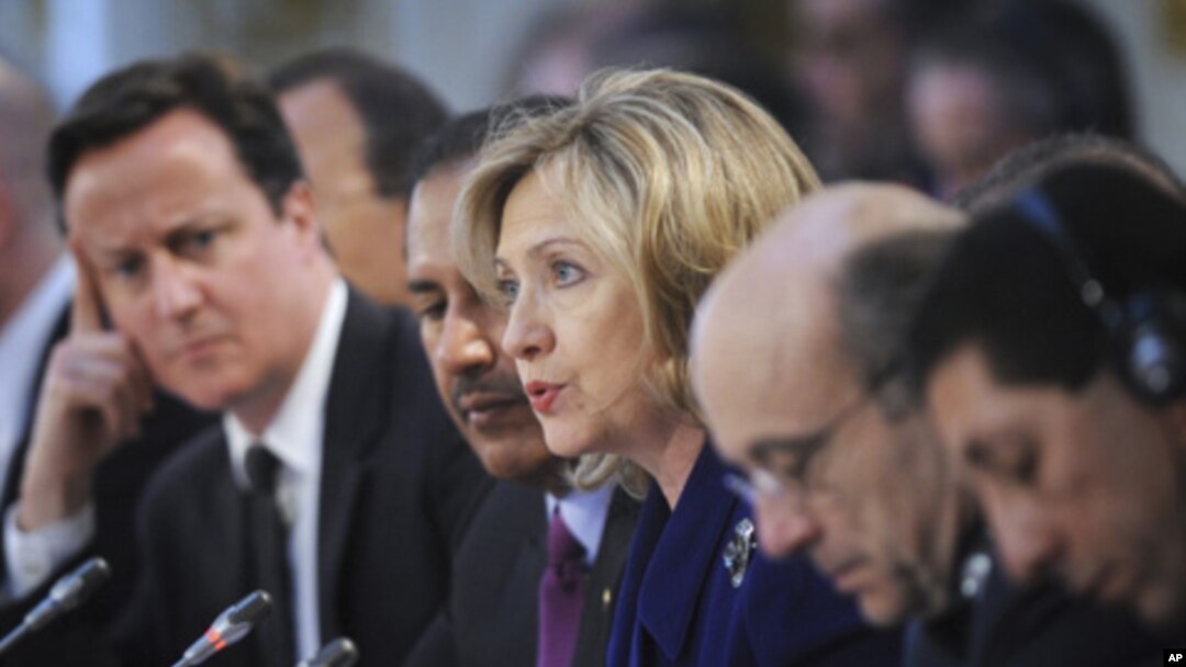 U.S. Secretary of State Hillary Clinton (center) speaks during a conference at the Foreign & Commonwealth Office in London, March 29, 2011
