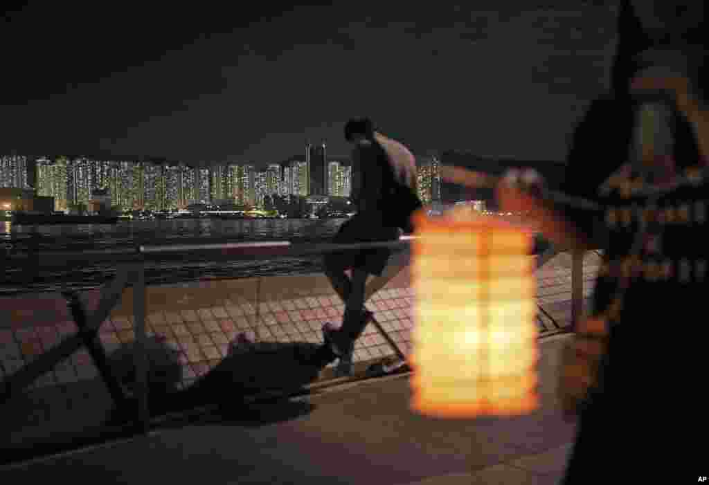 Residents hold up lanterns during the Chinese Mid-Autumn Festival at a park in Hong Kong.