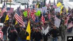 Protesters march in support of an Oregon ranching family facing jail time for arson in Burns, Ore., Jan. 2, 2016. Family members were convicted of the arsons three years ago and served time. But a judge ruled their terms were too short under federal law.