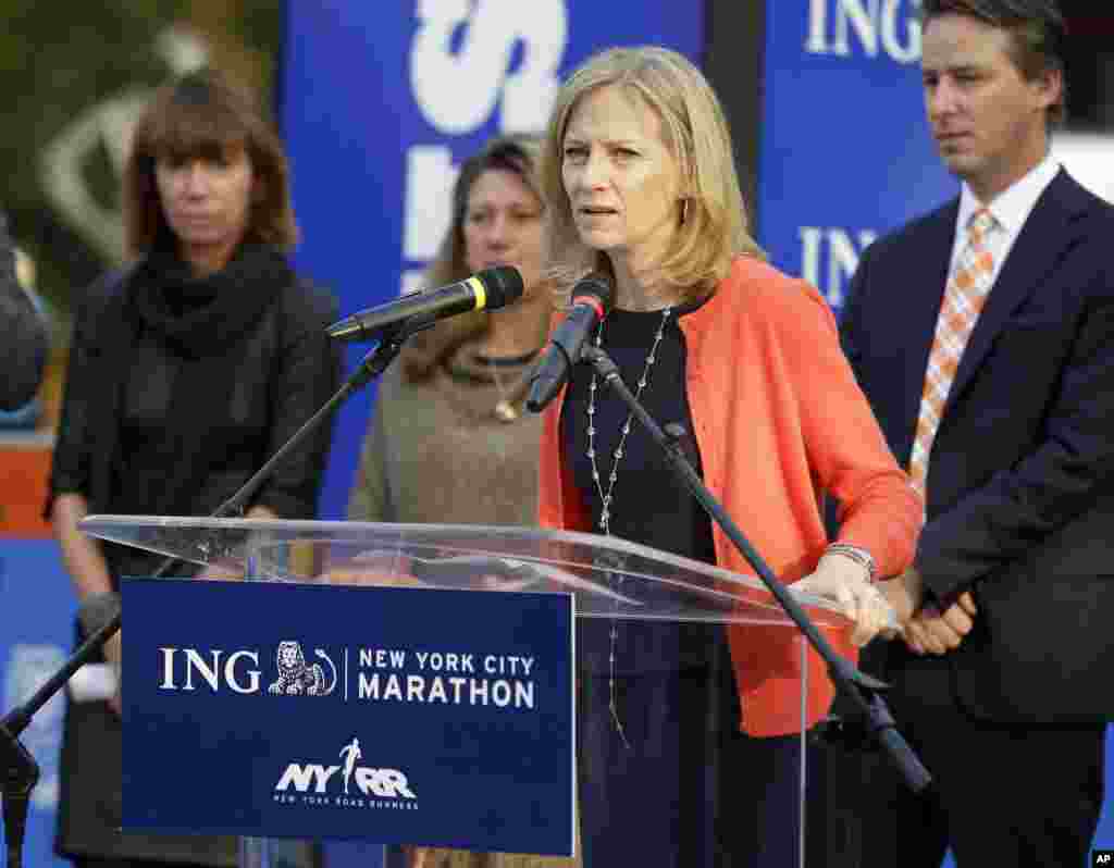 New York Road Runners President and CEO Mary Wittenberg speaks to reporters during a news conference at the finish line of the NYC Marathon in New York, Oct. 30, 2013.