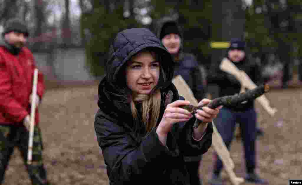 A resident takes part in a military exercise for civilians conducted by Christian Territorial Defense, amid threat of Russian invasion in Kyiv, Ukraine, Feb. 19, 2022.