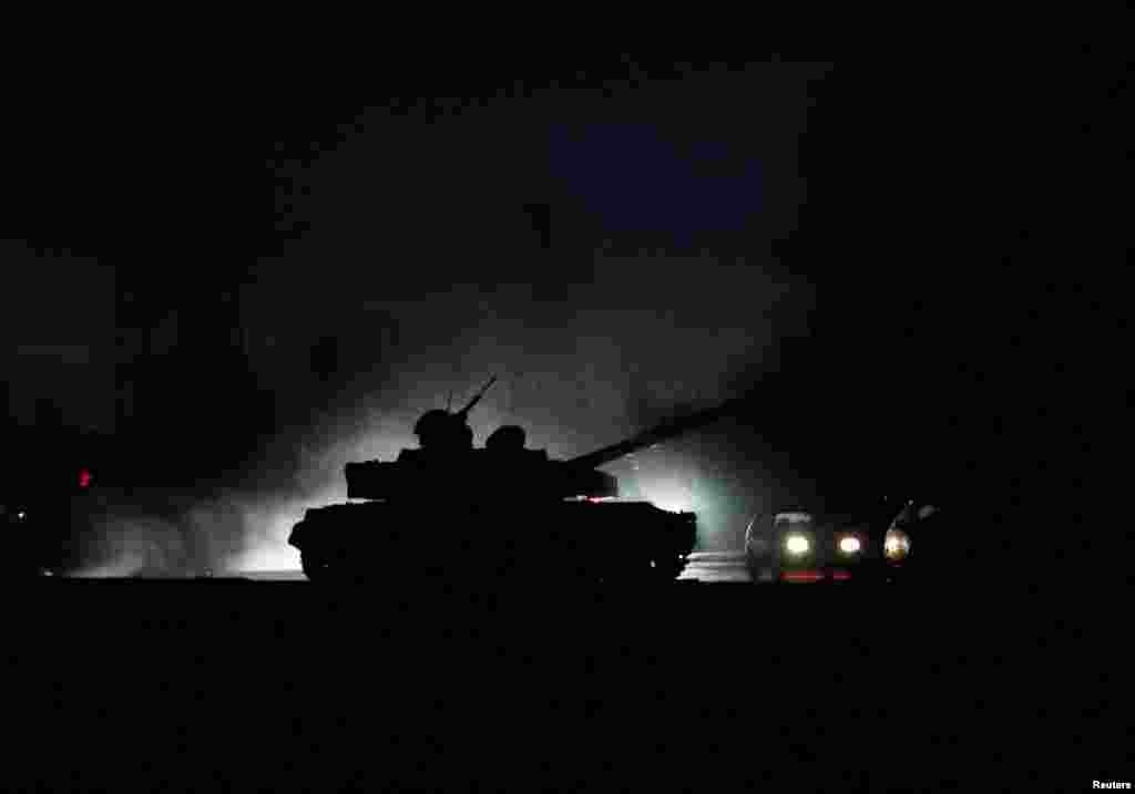 A tank drives along a street in the separatist-controlled city of Donetsk, Ukraine, after Russian President Vladimir Putin ordered the deployment of Russian troops to two breakaway regions in eastern Ukraine following the recognition of their independence.