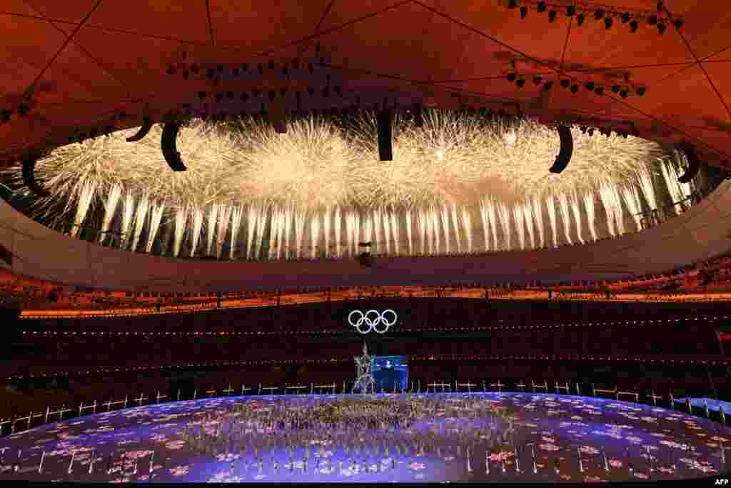 Fireworks light up the sky during the closing ceremony of the Beijing 2022 Winter Olympic Games, at the National Stadium, known as the Bird's Nest, in Beijing.