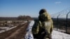 Ukrainian frontier guards patrol an area along the Ukrainian-Russian border in the Kharkiv region, Ukraine Feb. 23, 2022.