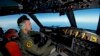 Royal Australian Air Force (RAAF) pilot, Flight Lieutenant Russell Adams from 10 Squadron, steers his AP-3C Orion over the Southern Indian Ocean during the search for missing Malaysian Airlines flight MH370, March 20, 2014.