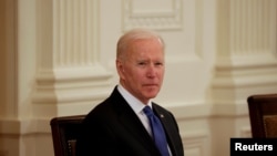 FILE - U.S. President Joe Biden holds first Cabinet meeting at the White House in Washington, U.S., April 1, 2021. REUTERS/Tom Brenner/File Photo