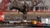 Salvage crews pull up a part of a Black Hawk helicopter near the site of a Jan. 29, 2025, mid-air collision between an American Airlines jet and a Black Hawk helicopter at Ronald Reagan Washington National Airport in Arlington, Virginia, Feb. 6, 2025.