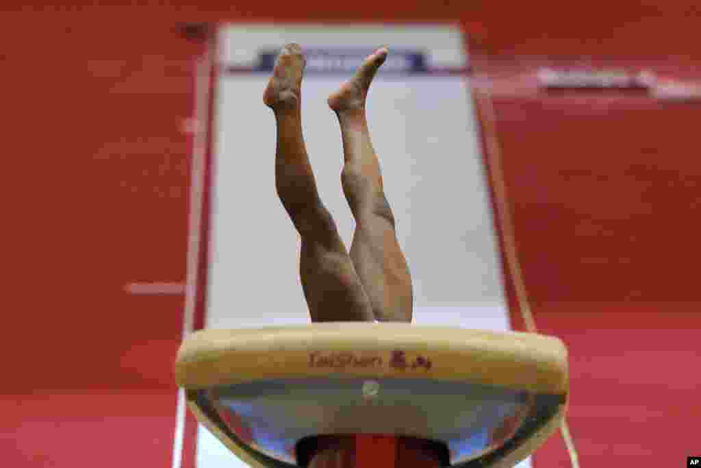 Gold medallist Simone Biles of the U.S. performs in the women's vault final on the first day of the apparatus finals of the of the Gymnastics World Chamionships at the Aspire Dome in Doha, Qatar.