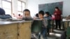 Students attend class at Pengying School on the outskirts of Beijing, Nov. 11, 2013.