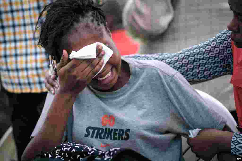 A woman reacts at the Chiromo mortuary, where the bodies of victims of an Islamist attack two days prior at the DusitD2 luxury hotel complex are kept, in Nairobi, on Jan. 17, 2019.