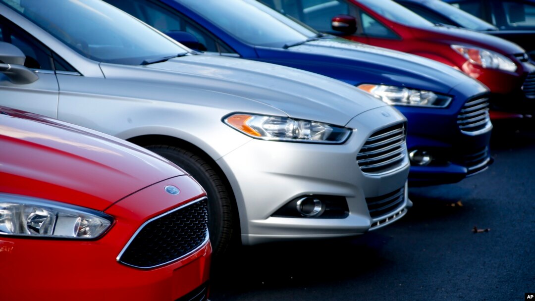 FILE - Ford Fusions are for sale on the lot at Butler County Ford in Butler, Pennsylvania, in November 2015. Ford Motor Co. has built the midsize Fusion sedan at its plant in Hermosillo, Mexico, since its introduction in 2005. 