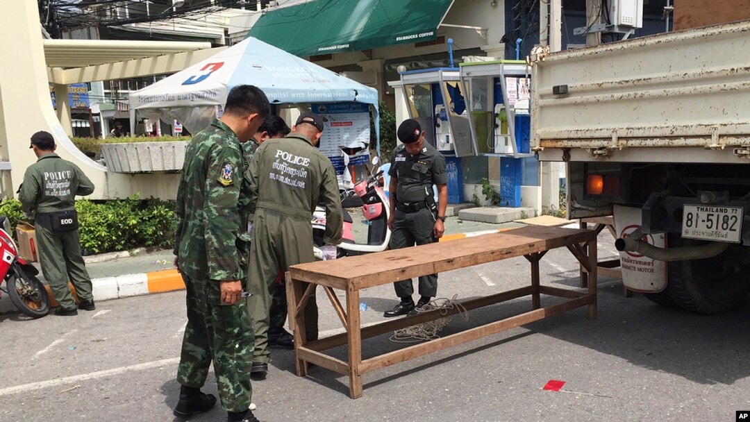 Investigators work at the scene of an explosion in the resort town of Hua Hin, 240 kilometers south of Bangkok, Thailand, Aug. 12, 2016.