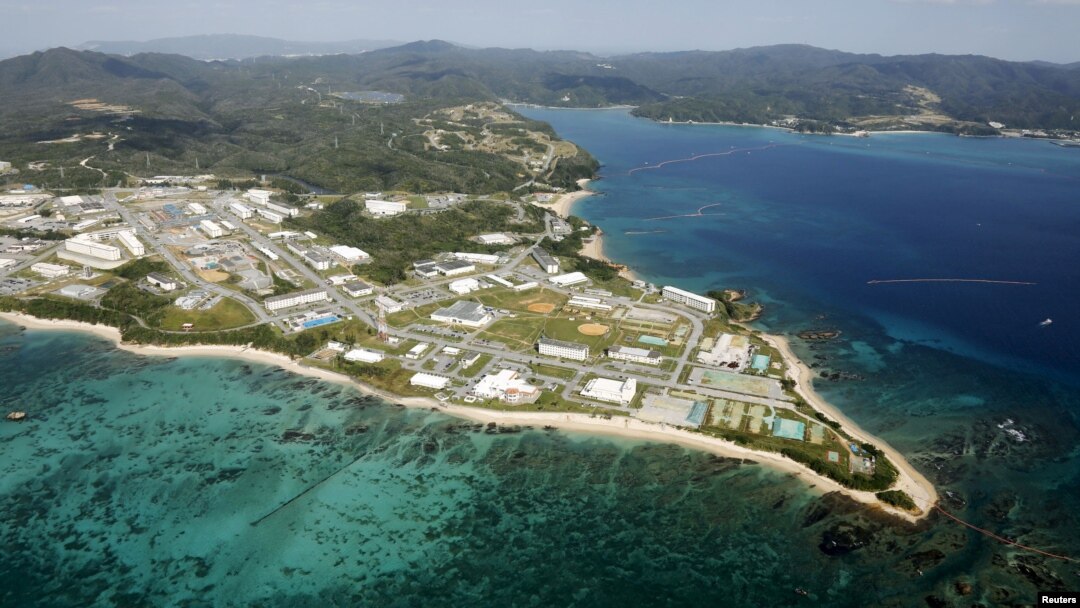 FILE - Coral reefs are seen along the coast near the U.S. Marine base Camp Schwab, off the tiny hamlet of Henoko in Nago on the southern Japanese island of Okinawa, in this aerial photo taken by Kyodo, Oct. 29, 2015.