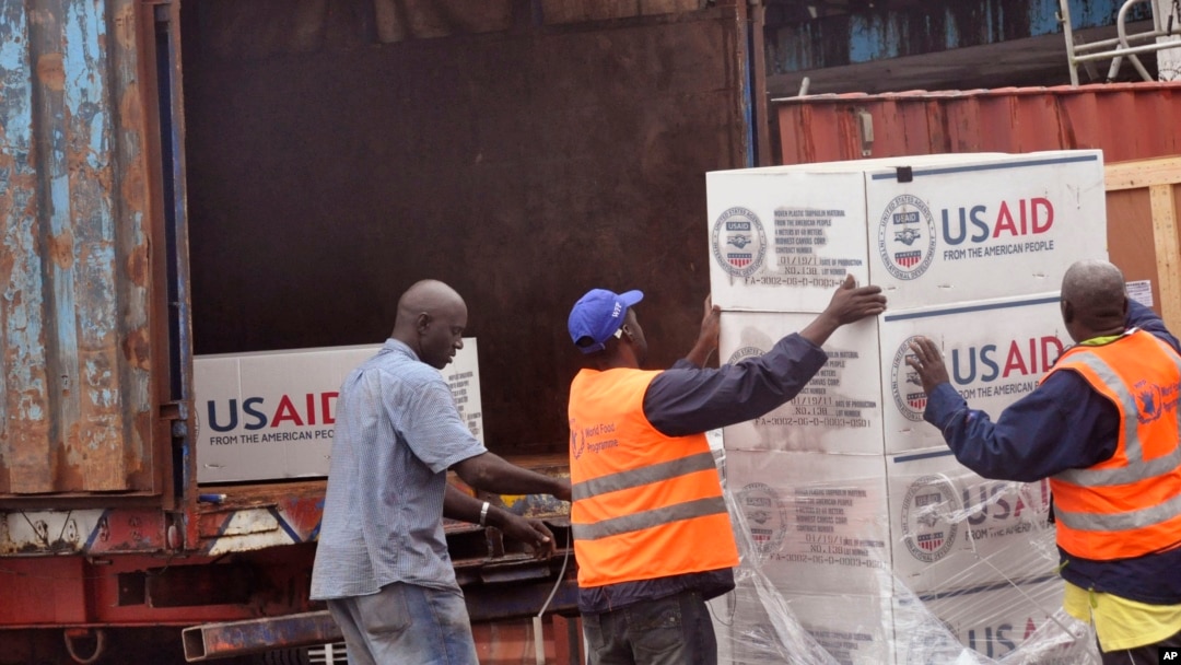 FILE - American aid goods are loaded onto a truck after it arrived by airplane, to be used in the fight against the Ebola virus spreading in the city of Monrovia, Liberia, Aug. 24, 2014. 