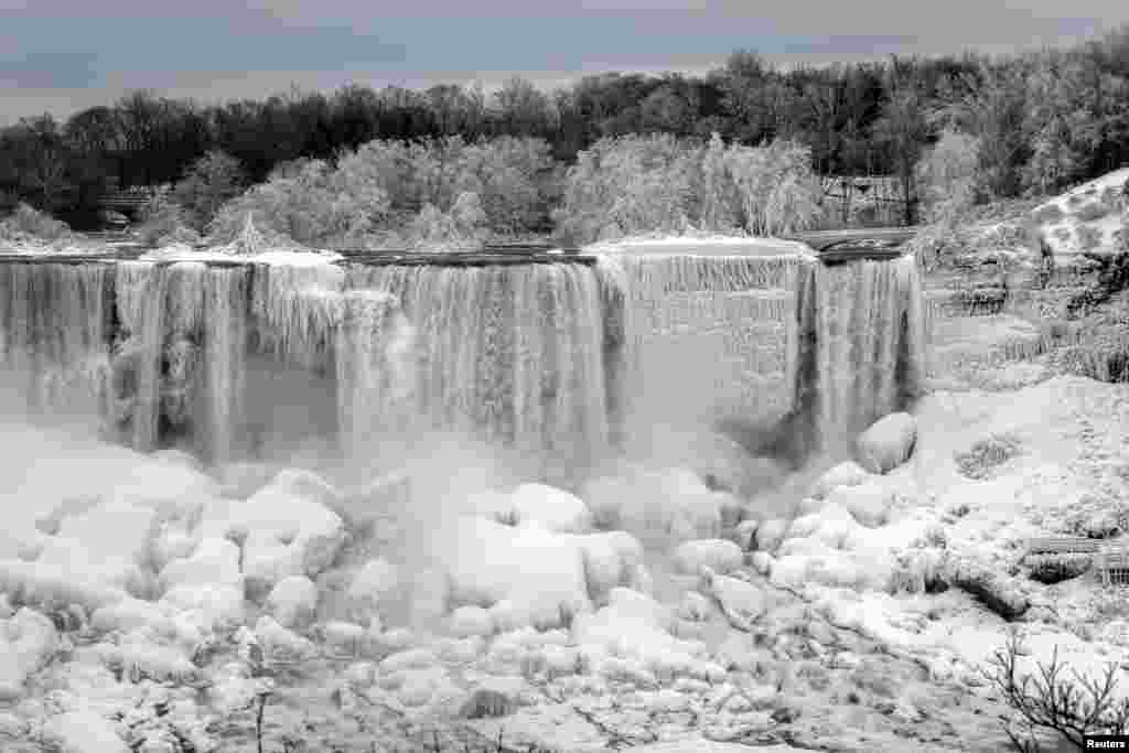 The American Falls in Niagara Falls, New York, is frozen due to subzero temperatures, viewed from the Canadian side, Ontario, Jan. 22, 2019.