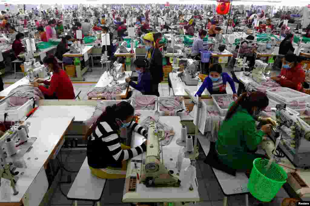 Employees work at a factory supplier of the H&M brand in Kandal province, Cambodia.