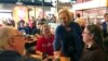 Sen. Kirsten Gillibrand, D-N.Y. greets patrons at Stomping Grounds Cafe in Ames, Iowa, on Saturday, Jan. 19, 2019.