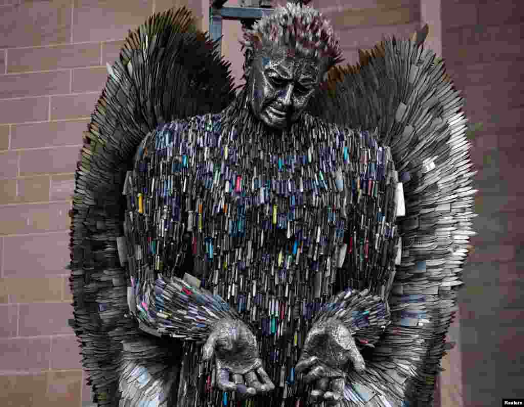 The 'Angel of Knives' sculpture by artist Alfie Bradley, made from over 100,000 confiscated knives, goes on display outside the Anglican Cathedral, in Liverpool, Britain.