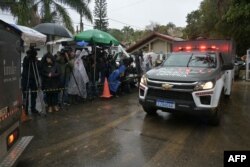 A police forensic truck leaves the Recanto Florido Condominium, where an airplane crashed with 62 people on board in Vinhedo, Sao Paulo, Brazil, on Aug. 10, 2024.