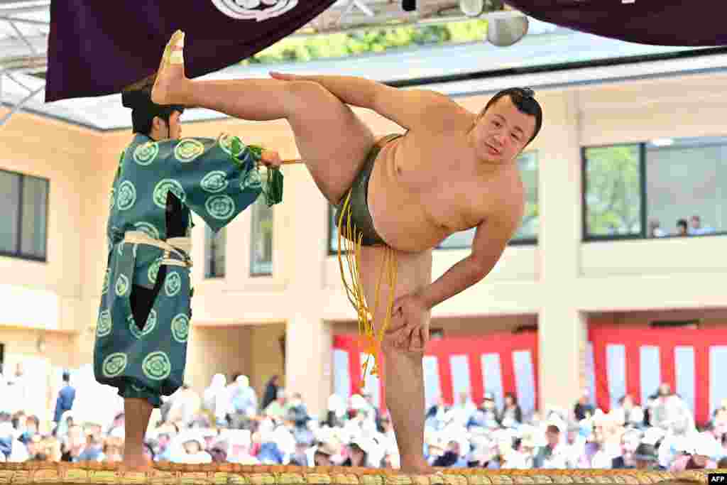 A sumo wrestler takes part in a 'honozumo,' a ceremonial sumo exhibition, on the grounds of Yasukuni Shrine in Tokyo, Japan, April 15, 2019.
