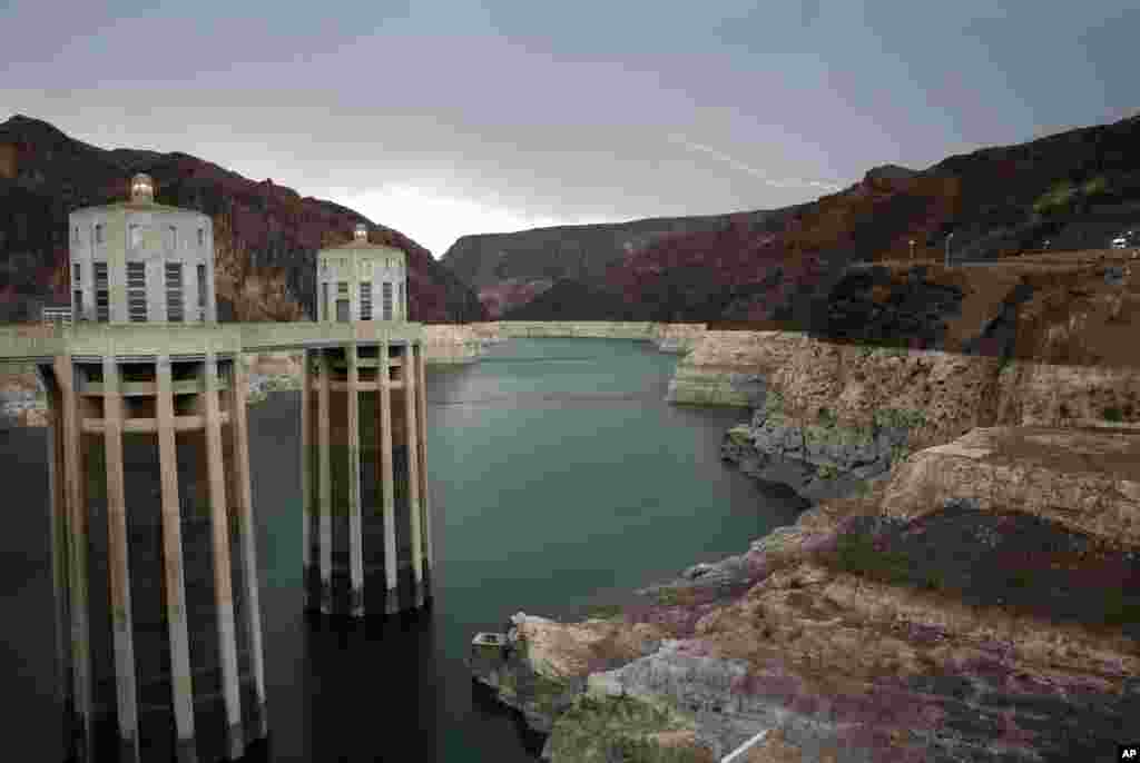 In this July 28, 2014 file photo, lightning strikes over Lake Mead near Hoover Dam at the Lake Mead National Recreation Area in Arizona. (AP Photo/John Locher, File)