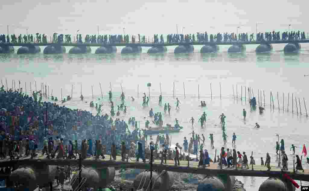 Indian Hindu devotees gather on the banks of the river Ganges to take a 'holy dip' on the occasion of Maghi Purnima during the annual traditional fair 'Magh Mela' in Allahabad.