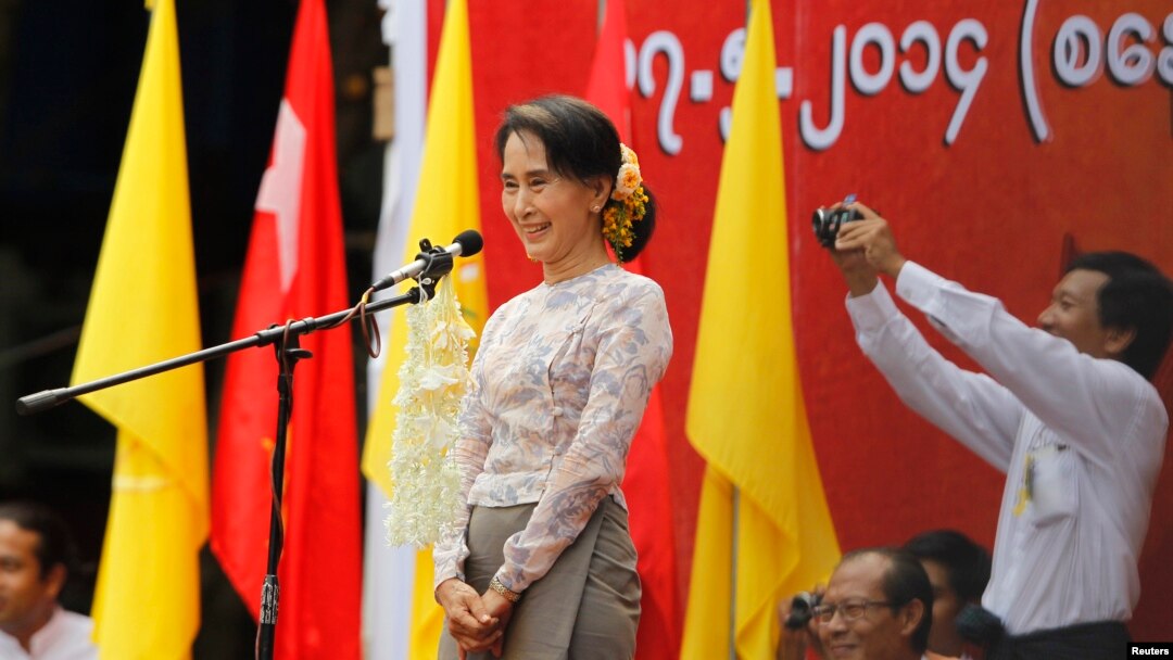 FILE - Myanmar's pro-democracy leader Aung San Suu Kyi delivers a speech at a rally in Boseinman Stadium in Yangon.