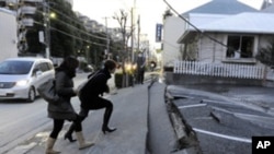 Japan's massive 8.9-magnitude earthquake collapsed a pedestrian road in Urayasu city, Chiba prefecture, Japan, March 11, 2011.